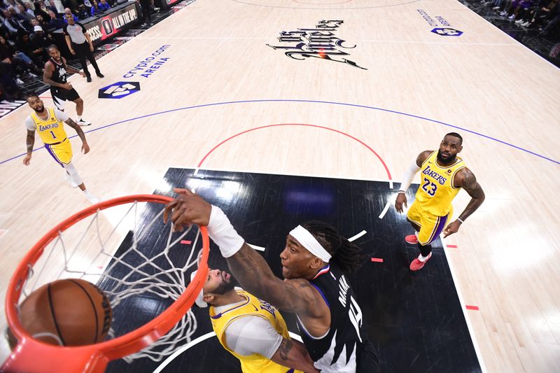 LOS ANGELES, CA - FEBRUARY 28:  Terance Mann #14 of the LA Clippers goes to the basket during the game on February 28, 2024 at Crypto.Com Arena in Los Angeles, California. NOTE TO USER: User expressly acknowledges and agrees that, by downloading and/or using this Photograph, user is consenting to the terms and conditions of the Getty Images License Agreement. Mandatory Copyright Notice: Copyright 2024 NBAE (Photo by Adam Pantozzi/NBAE via Getty Images)