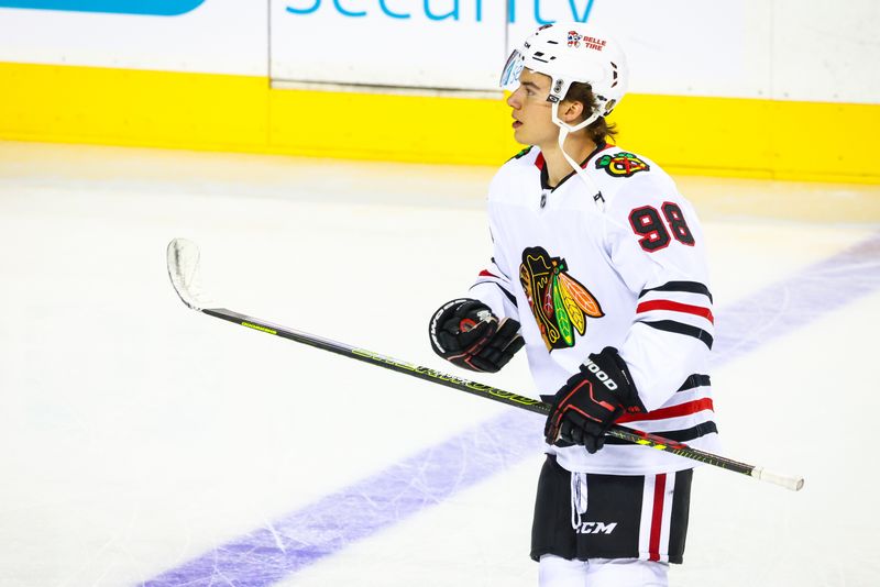 Oct 15, 2024; Calgary, Alberta, CAN; Chicago Blackhawks center Connor Bedard (98) skates during the warmup period against the Calgary Flames at Scotiabank Saddledome. Mandatory Credit: Sergei Belski-Imagn Images