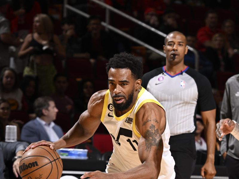 HOUSTON, TX - JANUARY 5: Mike Conley #11 of the Utah Jazz dribbles the ball during the game against the Houston Rockets on January 5, 2023 at the Toyota Center in Houston, Texas. NOTE TO USER: User expressly acknowledges and agrees that, by downloading and or using this photograph, User is consenting to the terms and conditions of the Getty Images License Agreement. Mandatory Copyright Notice: Copyright 2023 NBAE (Photo by Logan Riely/NBAE via Getty Images)