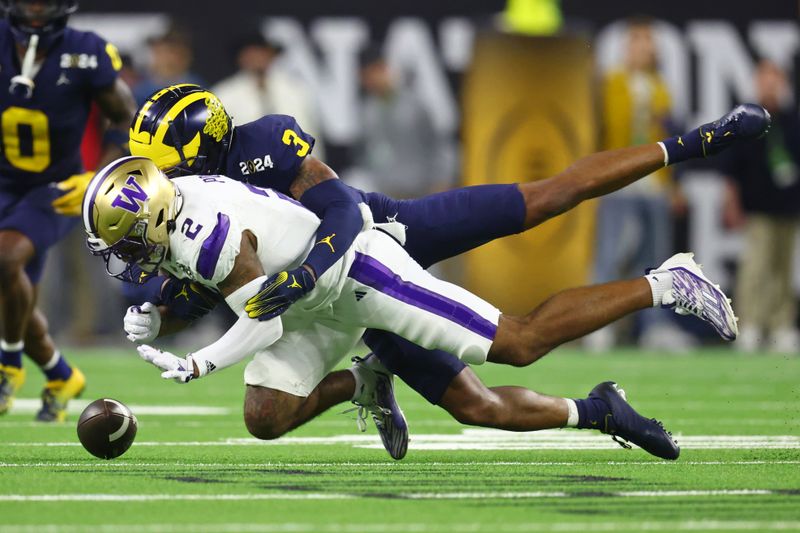 Jan 8, 2024; Houston, TX, USA; Washington Huskies wide receiver Ja'Lynn Polk (2) is unable to make a catch while defended by Michigan Wolverines defensive back Keon Sabb (3) during the fourth quarter in the 2024 College Football Playoff national championship game at NRG Stadium. Mandatory Credit: Mark J. Rebilas-USA TODAY Sports