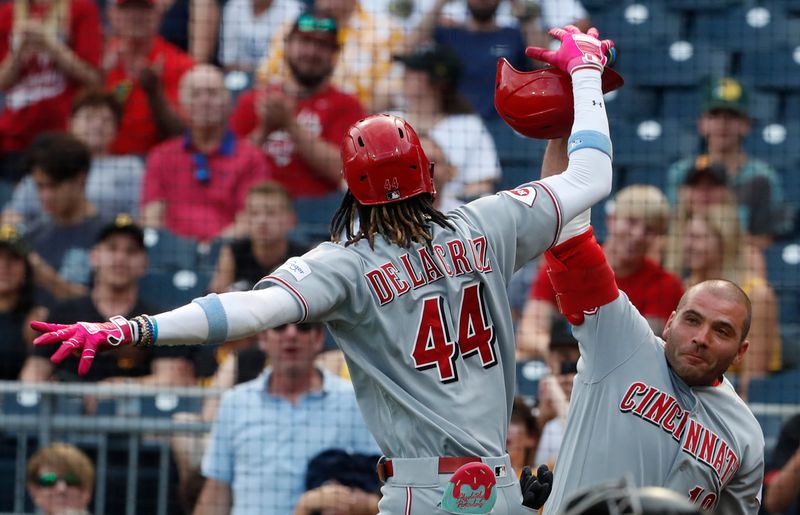 Aug 13, 2023; Pittsburgh, PA, USA; Cincinnati Reds shortstop Elly De La Cruz (44) celebrates his solo home run with designated hitter Joey Votto (right) against the Pittsburgh Pirates during the third inning at PNC Park. Mandatory Credit: Charles LeClaire-USA TODAY Sports