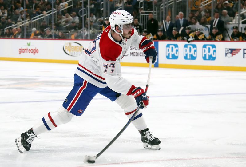 Nov 2, 2024; Pittsburgh, Pennsylvania, USA;  Montreal Canadiens center Kirby Dach (77) shoots the puck against the Pittsburgh Penguins during the second period at PPG Paints Arena. Mandatory Credit: Charles LeClaire-Imagn Images