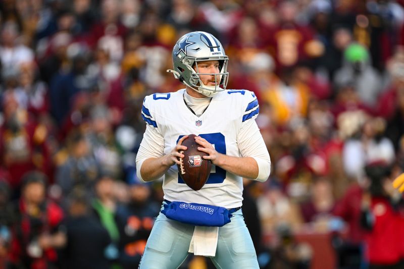 Dallas Cowboys quarterback Cooper Rush looks to pass the ball during the second half of an NFL football game against the Washington Commanders, Sunday, Nov. 24, 2024, in Landover, Md. (AP Photo/Terrance Williams)