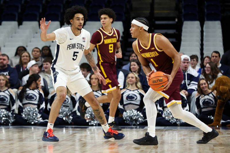 Feb 1, 2026; University Park, Pennsylvania, USA; Penn State Nittany Lions guard Freddie Dilione V (5) defends as Minnesota Golden Gophers guard Isaac Asuma (1) holds the ball during the first half at Bryce Jordan Center. Mandatory Credit: Matthew O'Haren-Imagn Images