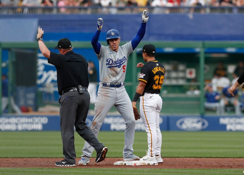 Jun 4, 2024; Pittsburgh, Pennsylvania, USA;  Los Angeles Dodgers first baseman Freddie Freeman (5) reacts at second base after hitting a double against the Pittsburgh Pirates during the third inning at PNC Park. Mandatory Credit: Charles LeClaire-USA TODAY Sports