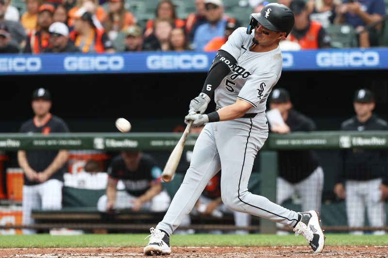May 30, 2025; Baltimore, Maryland, USA; Chicago White Sox third baseman Josh Rojas (5) takes a swing during the sixth inning against the Baltimore Orioles at Oriole Park at Camden Yards. Mandatory Credit: Daniel Kucin Jr.-Imagn Images