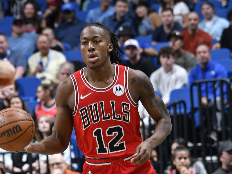 ORLANDO, FL - FEBRUARY 10: Ayo Dosunmu #12 of the Chicago Bulls dribbles the ball during the game against the Orlando Magic on February 10, 2024 at the Kia Center in Orlando, Florida. NOTE TO USER: User expressly acknowledges and agrees that, by downloading and or using this photograph, User is consenting to the terms and conditions of the Getty Images License Agreement. Mandatory Copyright Notice: Copyright 2024 NBAE (Photo by Fernando Medina/NBAE via Getty Images)