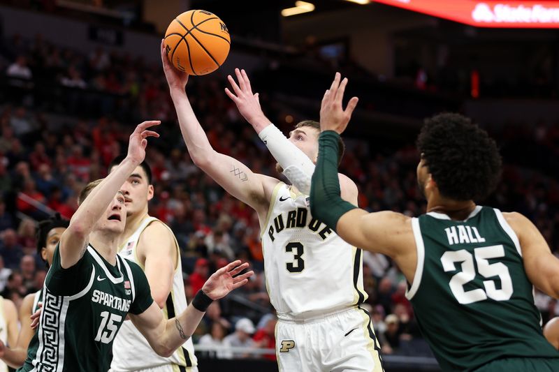 Mar 15, 2024; Minneapolis, MN, USA; Purdue Boilermakers guard Braden Smith (3) shoots as Michigan State Spartans center Carson Cooper (15) and forward Malik Hall (25) defend during the first half at Target Center. Mandatory Credit: Matt Krohn-USA TODAY Sports