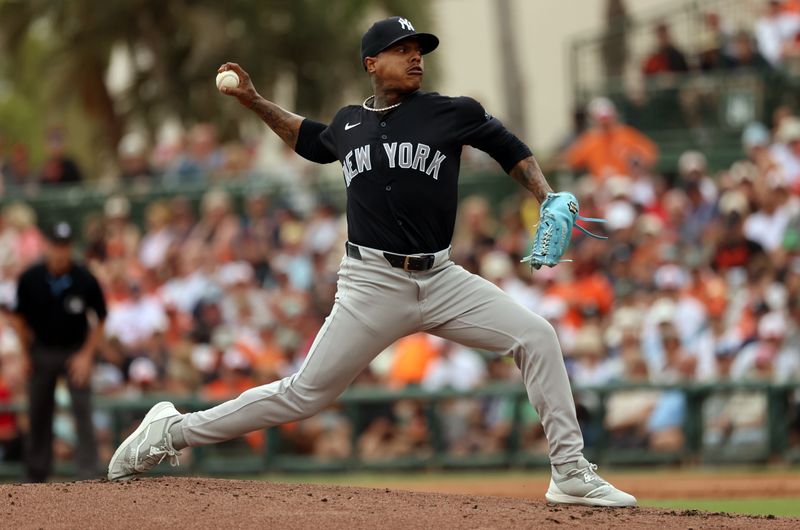 Mar 2, 2024; Sarasota, Florida, USA; New York Yankees starting pitcher Marcus Stroman (0) throws a pitch during the first inning against the Baltimore Orioles  at Ed Smith Stadium. Mandatory Credit: Kim Klement Neitzel-USA TODAY Sports