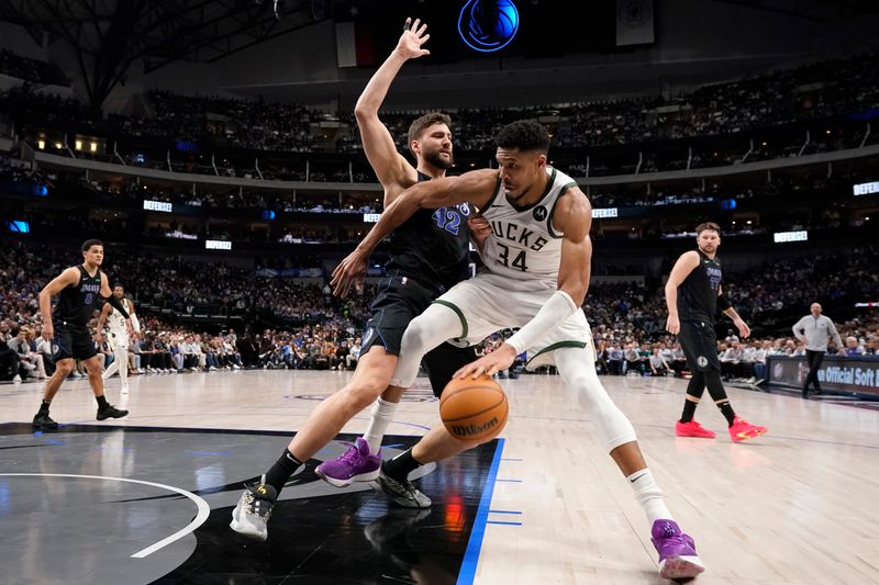 DALLAS, TEXAS - FEBRUARY 03: Giannis Antetokounmpo #34 of the Milwaukee Bucks is defended by Maxi Kleber #42 of the Dallas Mavericks during the second half at American Airlines Center on February 03, 2024 in Dallas, Texas. NOTE TO USER: User expressly acknowledges and agrees that, by downloading and or using this photograph, User is consenting to the terms and conditions of the Getty Images License Agreement. (Photo by Sam Hodde/Getty Images)