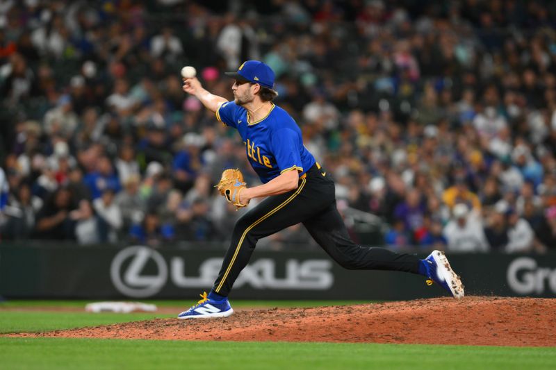 Sep 14, 2024; Seattle, Washington, USA; Seattle Mariners relief pitcher Collin Snider (52) pitches to the Texas Rangers during the eighth inning at T-Mobile Park. Mandatory Credit: Steven Bisig-Imagn Images