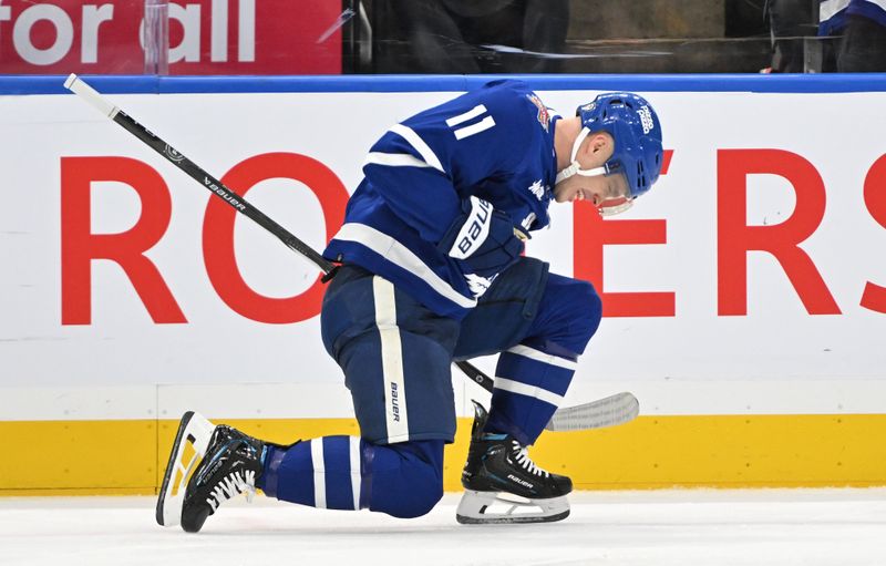 Dec 2, 2023; Toronto, Ontario, CAN; Toronto Maple Leafs forward Max Domi (11) celebrates after scoring a goal against the Boston Bruins in the third period at Scotiabank Arena. Mandatory Credit: Dan Hamilton-USA TODAY Sports