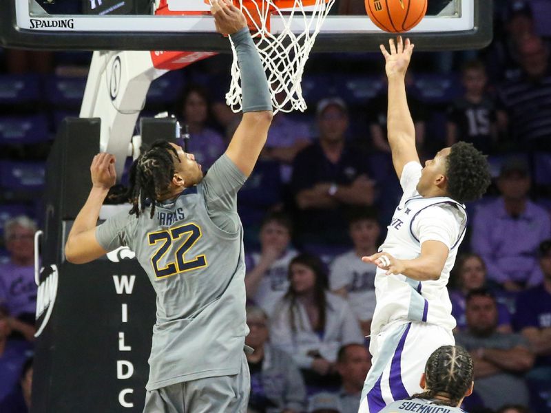 Feb 26, 2024; Manhattan, Kansas, USA; Kansas State Wildcats guard Tylor Perry (2) shoots against West Virginia Mountaineers forward Josiah Harris (22) during overtime at Bramlage Coliseum. Mandatory Credit: Scott Sewell-USA TODAY Sports