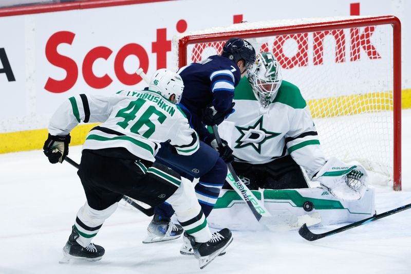 Mar 14, 2025; Winnipeg, Manitoba, CAN;  Dallas Stars goalie Jake Oettinger (29) stops Winnipeg Jets forward Vladislav Namestnikov (7) during the third period at Canada Life Centre. Mandatory Credit: Terrence Lee-Imagn Images