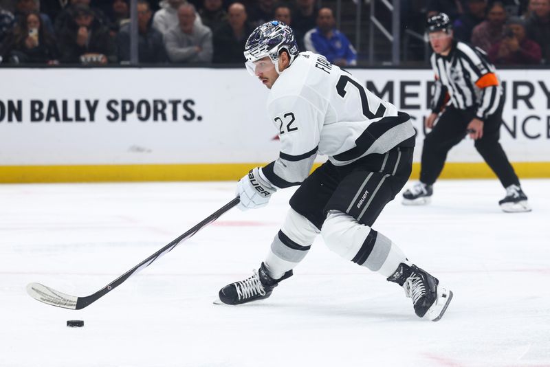 Dec 27, 2023; Los Angeles, California, USA; Los Angeles Kings left wing Kevin Fiala (22) skates with the puck on a breakaway during the second period of a game against the San Jose Sharks at Crypto.com Arena. Mandatory Credit: Jessica Alcheh-USA TODAY Sports