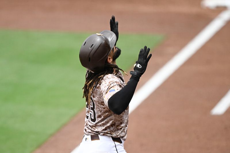 Jun 9, 2024; San Diego, California, USA; San Diego Padres right fielder Fernando Tatis Jr. (23) looks skyward after hitting a solo home run during the first inning against the Arizona Diamondbacks at Petco Park. Mandatory Credit: Denis Poroy-USA TODAY Sports at Petco Park. 