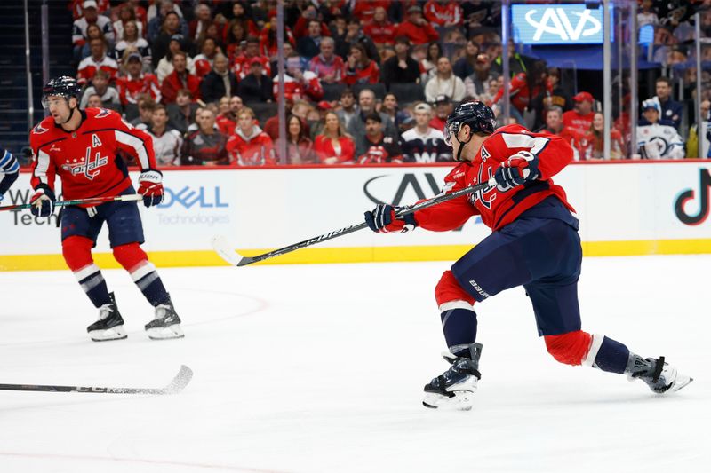 Nov 26, 2025; Washington, District of Columbia, USA; Washington Capitals defenseman John Carlson (74) scores a goal /Wednesday/ during the first period at Capital One Arena. Mandatory Credit: Geoff Burke-Imagn Images