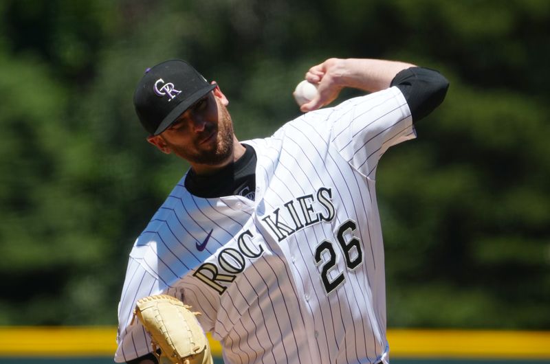 Jun 25, 2023; Denver, Colorado, USA; Colorado Rockies starting pitcher Austin Gomber (26) delivers a pitch in the first inning against the Los Angeles Angels at Coors Field. Mandatory Credit: Ron Chenoy-USA TODAY Sports