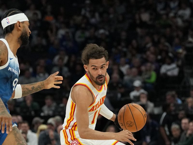 MINNEAPOLIS, MN -  APRIL 12: Trae Young #11 of the Atlanta Hawks handles the ball during the game against the Minnesota Timberwolves on April 12, 2024 at Target Center in Minneapolis, Minnesota. NOTE TO USER: User expressly acknowledges and agrees that, by downloading and or using this Photograph, user is consenting to the terms and conditions of the Getty Images License Agreement. Mandatory Copyright Notice: Copyright 2024 NBAE (Photo by Jordan Johnson/NBAE via Getty Images)