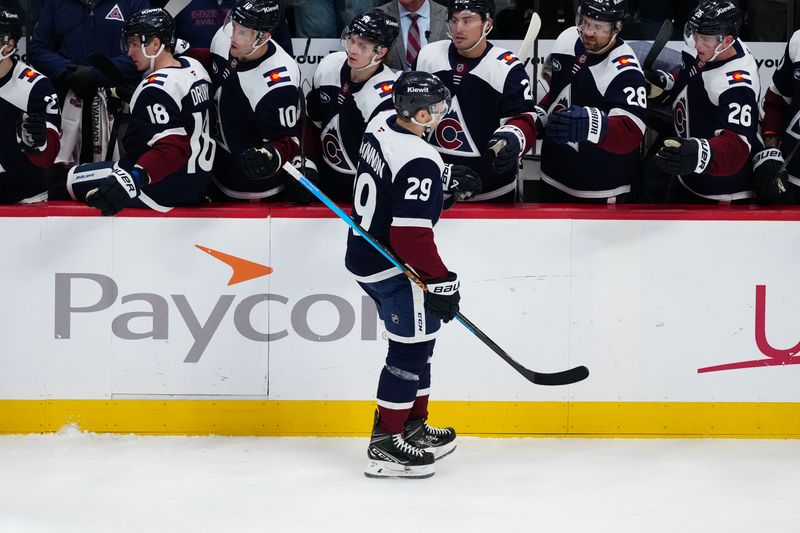 Mar 10, 2025; Denver, Colorado, USA; Colorado Avalanche center Nathan MacKinnon (29) celebrates an assist of a goal in the third period against the Chicago Blackhawks at Ball Arena. Mandatory Credit: Ron Chenoy-Imagn Images