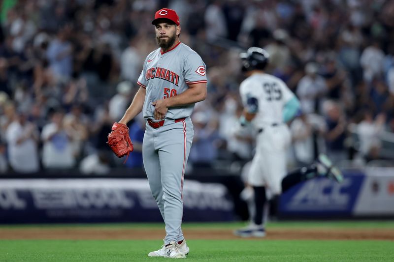 Jul 2, 2024; Bronx, New York, USA; New York Yankees designated hitter Aaron Judge (99) rounds the bases after hitting a solo home run against Cincinnati Reds relief pitcher Sam Moll (50) during the seventh inning at Yankee Stadium. Mandatory Credit: Brad Penner-USA TODAY Sports