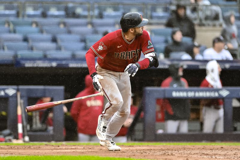 Sep 24, 2023; Bronx, New York, USA; Arizona Diamondbacks shortstop Jordan Lawlar (10) hits a long fly ball and reaches first base after an error by New York Yankees left fielder Oswaldo Cabrera (95) during the seventh inning at Yankee Stadium. Mandatory Credit: John Jones-USA TODAY Sports