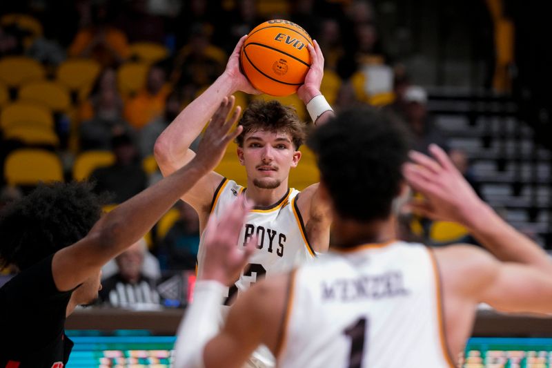 Feb 27, 2024; Laramie, Wyoming, USA; Wyoming Cowboys forward Mason Walters (33) looks to pass against the UNLV Runnin' Rebels during the second half at Arena-Auditorium. Mandatory Credit: Troy Babbitt-USA TODAY Sports