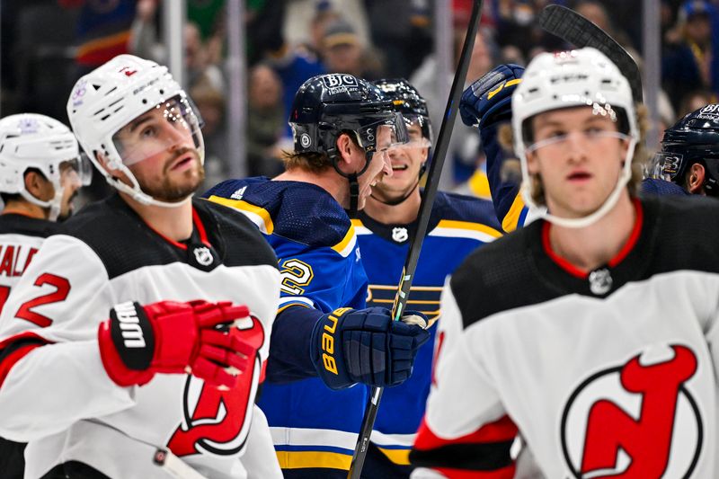 Nov 3, 2023; St. Louis, Missouri, USA;  St. Louis Blues center Kevin Hayes (12) celebrates with teammates after scoring against the New Jersey Devils during the second period at Enterprise Center. Mandatory Credit: Jeff Curry-USA TODAY Sports