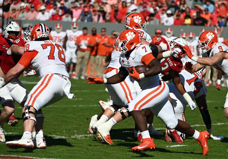 Oct 28, 2023; Raleigh, North Carolina, USA; Clemson Tigers running back Phil Mafah (7) runs the ball during the first half against the North Carolina State Wolfpack at Carter-Finley Stadium. Mandatory Credit: Rob Kinnan-USA TODAY Sports