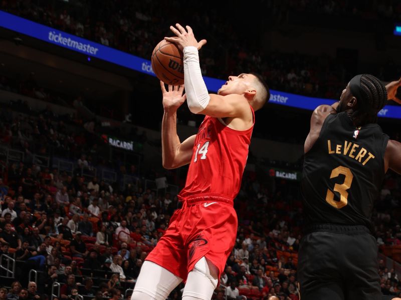 MIAMI, FL - DECEMBER 8: Tyler Herro #14 of the Miami Heat drives to the basket during the game against the Cleveland Cavaliers on December 8, 2024 at Kaseya Center in Miami, Florida. NOTE TO USER: User expressly acknowledges and agrees that, by downloading and or using this Photograph, user is consenting to the terms and conditions of the Getty Images License Agreement. Mandatory Copyright Notice: Copyright 2024 NBAE (Photo by Issac Baldizon/NBAE via Getty Images)