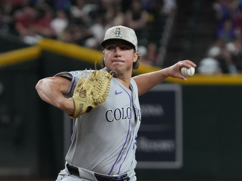 May 18, 2025; Phoenix, Arizona, USA; Colorado Rockies pitcher Ryan Rolison (50) throws against the Arizona Diamondbacks in the fifth inning at Chase Field. Mandatory Credit: Rick Scuteri-Imagn Images