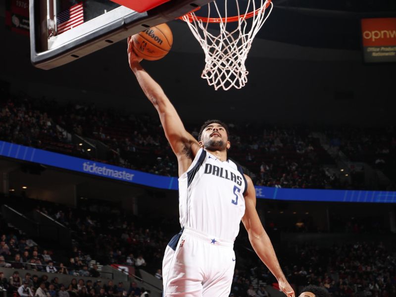 PORTLAND, OR - DECEMBER 1: Quentin Grimes #5 of the Dallas Mavericks dunks the ball during the game against the Portland Trail Blazers on December 1, 2024 at the Moda Center Arena in Portland, Oregon. NOTE TO USER: User expressly acknowledges and agrees that, by downloading and or using this photograph, user is consenting to the terms and conditions of the Getty Images License Agreement. Mandatory Copyright Notice: Copyright 2024 NBAE (Photo by Cameron Browne/NBAE via Getty Images)