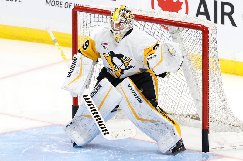 Oct 20, 2024; Winnipeg, Manitoba, CAN; Pittsburgh Penguins goaltender Alex Nedeljkovic (39) warms up before a game against the Winnipeg Jets at Canada Life Centre. Mandatory Credit: James Carey Lauder-Imagn Images