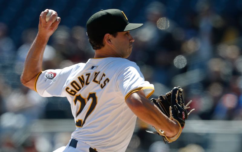 Apr 7, 2024; Pittsburgh, Pennsylvania, USA;  Pittsburgh Pirates starting pitcher Marco Gonzales (27) delivers a pitch against the Baltimore Orioles during the first inning at PNC Park. Mandatory Credit: Charles LeClaire-USA TODAY Sports