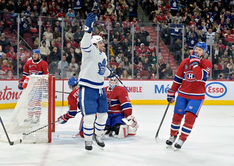 Mar 9, 2024; Montreal, Quebec, CAN; Toronto Maple Leafs forward John Tavares (91) celebrates after scoring a goal against Montreal Canadiens goalie Sam Montembeault (35) during the third period at the Bell Centre. Mandatory Credit: Eric Bolte-USA TODAY Sports