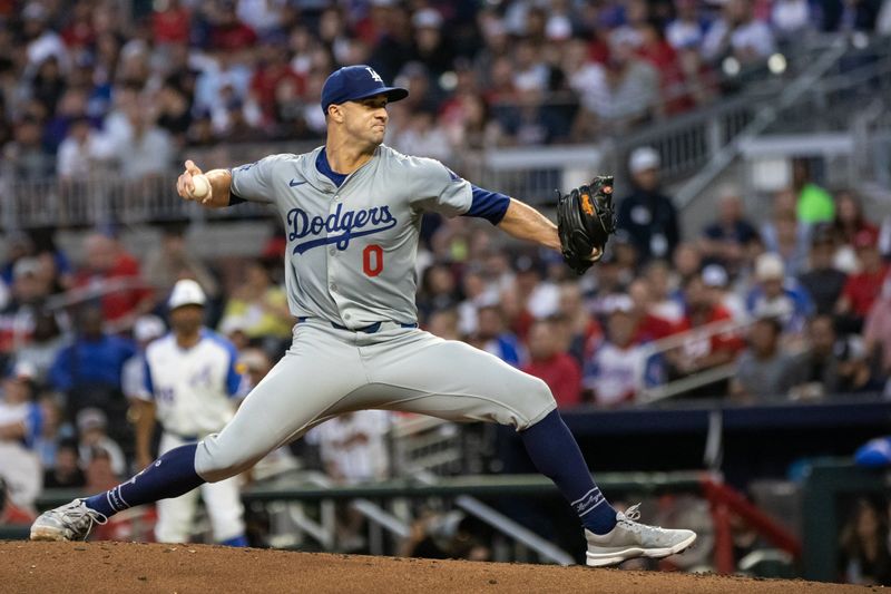 Sep 14, 2024; Cumberland, Georgia, USA; Los Angeles Dodgers pitcher Jack Flaherty (0) pitches the ball against the Atlanta Braves during the first inning at Truist Park. Mandatory Credit: Jordan Godfree-Imagn Images