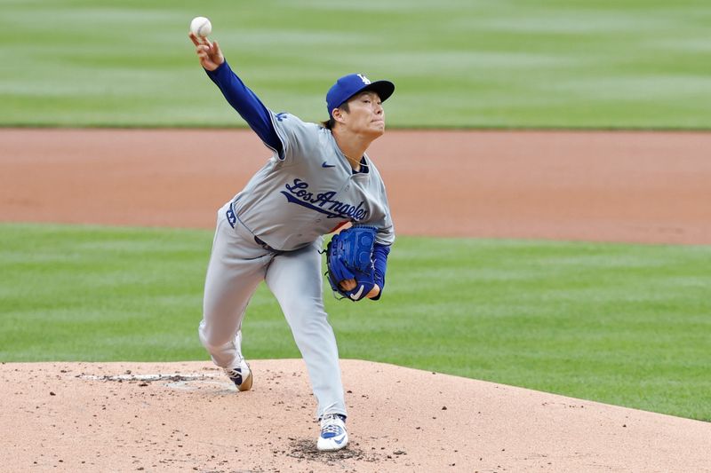 Apr 25, 2024; Washington, District of Columbia, USA; Los Angeles Dodgers starting pitcher Yoshinobu Yamamoto (18) pitches against the Washington Nationals during the first inning at Nationals Park. Mandatory Credit: Geoff Burke-USA TODAY Sports