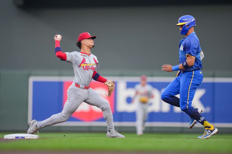 Aug 23, 2024; Minneapolis, Minnesota, USA; St. Louis Cardinals shortstop Masyn Winn (0) throws to first base against the Minnesota Twins in the first inning at Target Field. Mandatory Credit: Brad Rempel-USA TODAY Sports