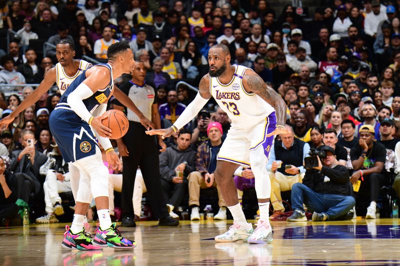 LOS ANGELES, CA - NOVEMBER 23: LeBron James #23 of the Los Angeles Lakers plays defense during the game against the Denver Nuggets on November 23, 2024 at Crypto.Com Arena in Los Angeles, California. NOTE TO USER: User expressly acknowledges and agrees that, by downloading and/or using this Photograph, user is consenting to the terms and conditions of the Getty Images License Agreement. Mandatory Copyright Notice: Copyright 2024 NBAE (Photo by Adam Pantozzi/NBAE via Getty Images)