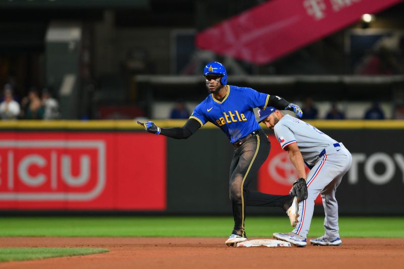 Sep 14, 2024; Seattle, Washington, USA; Seattle Mariners right fielder Victor Robles (10) celebrates after hitting a double against the Texas Rangers during the ninth inning at T-Mobile Park. Mandatory Credit: Steven Bisig-Imagn Images