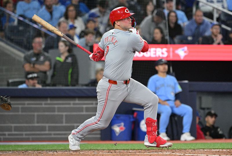 Aug 19, 2024; Toronto, Ontario, CAN; Cincinnati Reds first baseman Ty France (2) hits a two-RBI double against the Toronto Blue Jays in the sixth inning at Rogers Centre. Mandatory Credit: Dan Hamilton-USA TODAY Sports