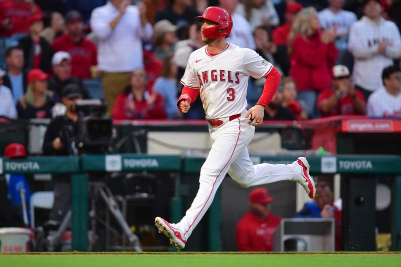 Apr 23, 2024; Anaheim, California, USA; Los Angeles Angels designated hitter Taylor Ward (3) runs home to score against the Baltimore Orioles during the third inning at Angel Stadium. Mandatory Credit: Gary A. Vasquez-USA TODAY Sports