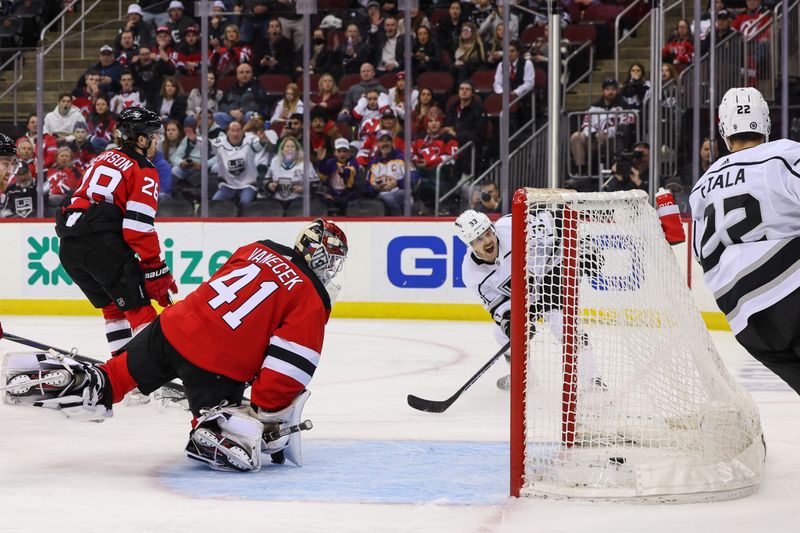 Feb 23, 2023; Newark, New Jersey, USA; Los Angeles Kings right wing Viktor Arvidsson (33) scores a goal on New Jersey Devils goaltender Vitek Vanecek (41) during the first period at Prudential Center. Mandatory Credit: Ed Mulholland-USA TODAY Sports