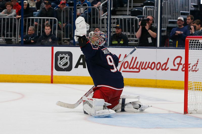 Oct 28, 2024; Columbus, Ohio, USA; Columbus Blue Jackets goalie Elvis Merzlikins (90) makes a glove save against the Edmonton Oilers during the third period at Nationwide Arena. Mandatory Credit: Russell LaBounty-Imagn Images