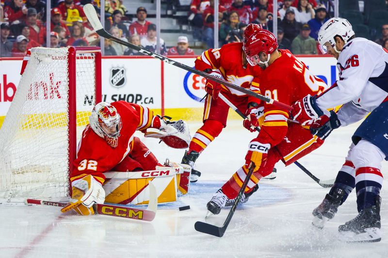 Mar 18, 2024; Calgary, Alberta, CAN; Calgary Flames goaltender Dustin Wolf (32) makes a save against the Washington Capitals during the first period at Scotiabank Saddledome. Mandatory Credit: Sergei Belski-USA TODAY Sports