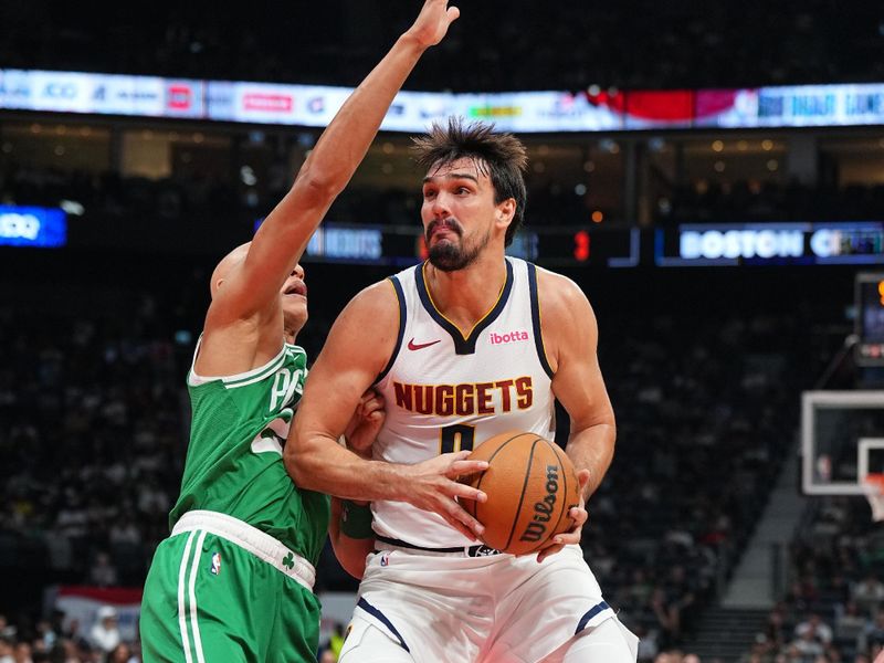 ABU DHABI, UAE - OCTOBER 6: Dario Saric #9 of the Denver Nuggets drives to the basket during the game against the Boston Celtics during the 2024 Global Games on October 6, 2024 at the Etihad Arena in Abu Dhabi, United Arab Emirates. NOTE TO USER: User expressly acknowledges and agrees that, by downloading and/or using this Photograph, user is consenting to the terms and conditions of the Getty Images License Agreement. Mandatory Copyright Notice: Copyright 2024 NBAE (Photo by Garrett Ellwood/NBAE via Getty Images)