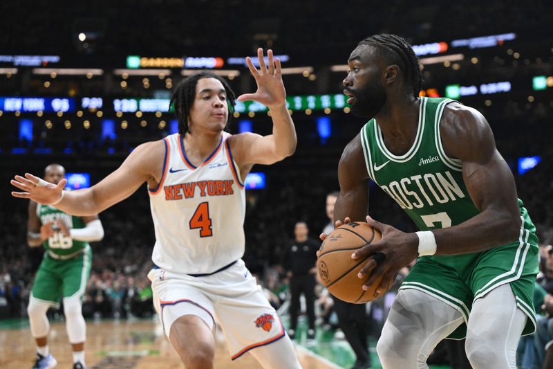 BOSTON, MASSACHUSETTS - OCTOBER 22: Jaylen Brown #7 of the Boston Celtics makes a move on Pacome Dadiet #4 of the New York Knicks during the fourth quarter at TD Garden on October 22, 2024 in Boston, Massachusetts. (Photo by Brian Fluharty/Getty Images)