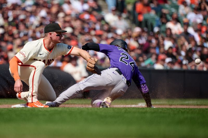 May 4, 2025; San Francisco, California, USA; Colorado Rockies third baseman Ryan McMahon (24) slides into third base with an RBI triple against the San Francisco Giants during the eighth inning at Oracle Park. Mandatory Credit: Robert Edwards-Imagn Images