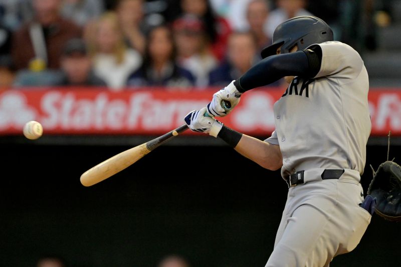 May 26, 2025; Anaheim, California, USA;  New York Yankees shortstop Anthony Volpe (11) doubles in three runs in the fourth inning against the Los Angeles Angels at Angel Stadium. Mandatory Credit: Jayne Kamin-Oncea-Imagn Images