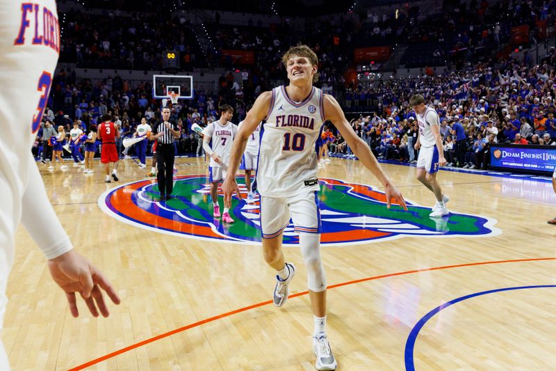 Jan 6, 2026; Gainesville, Florida, USA; Florida Gators forward Thomas Haugh (10) celebrates the win over the Georgia Bulldogs at Exactech Arena at the Stephen C. O'Connell Center. Mandatory Credit: Morgan Tencza-Imagn Images